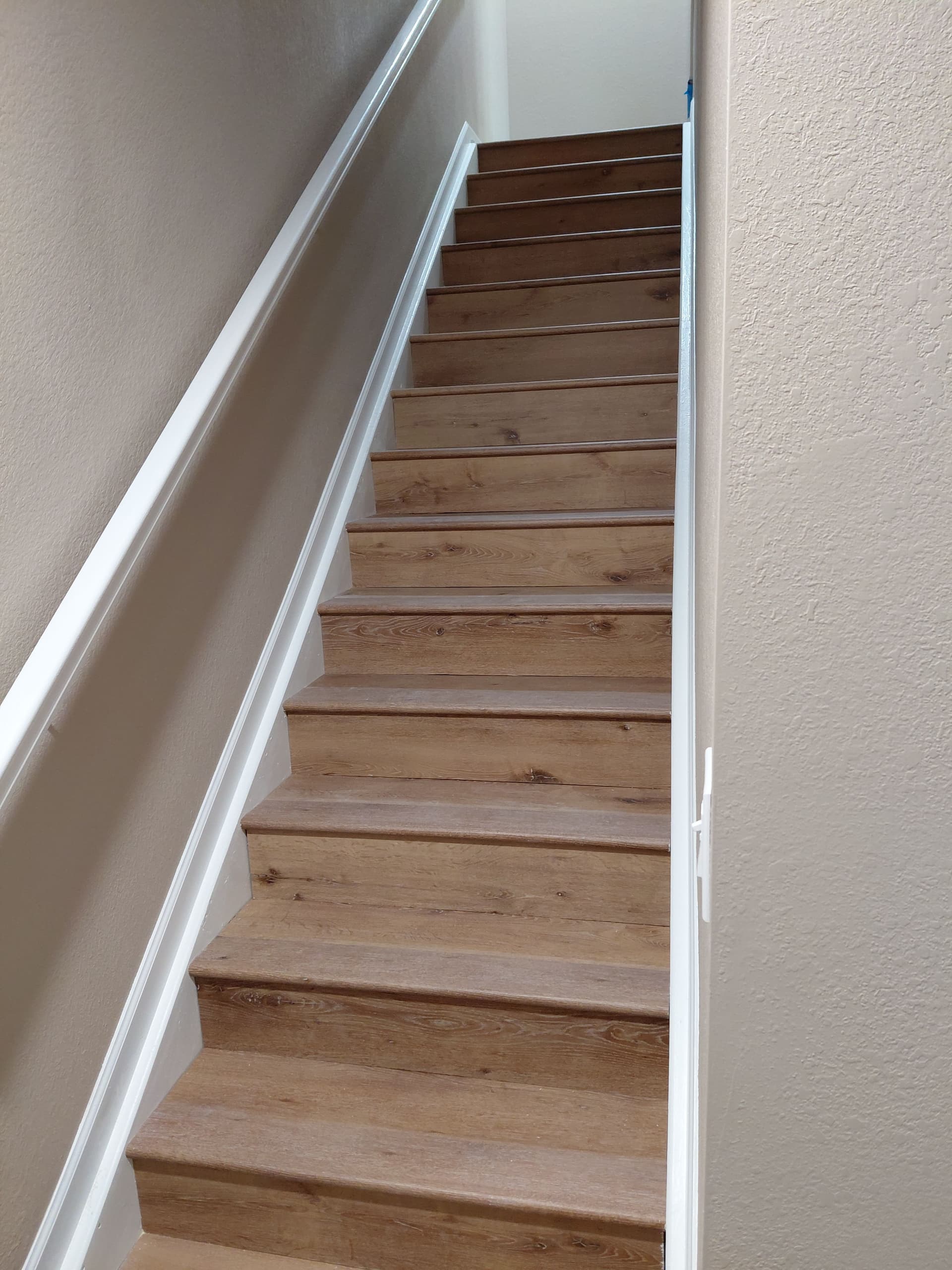 Beautiful Basement Makeover with New Flooring and Stylish Trim