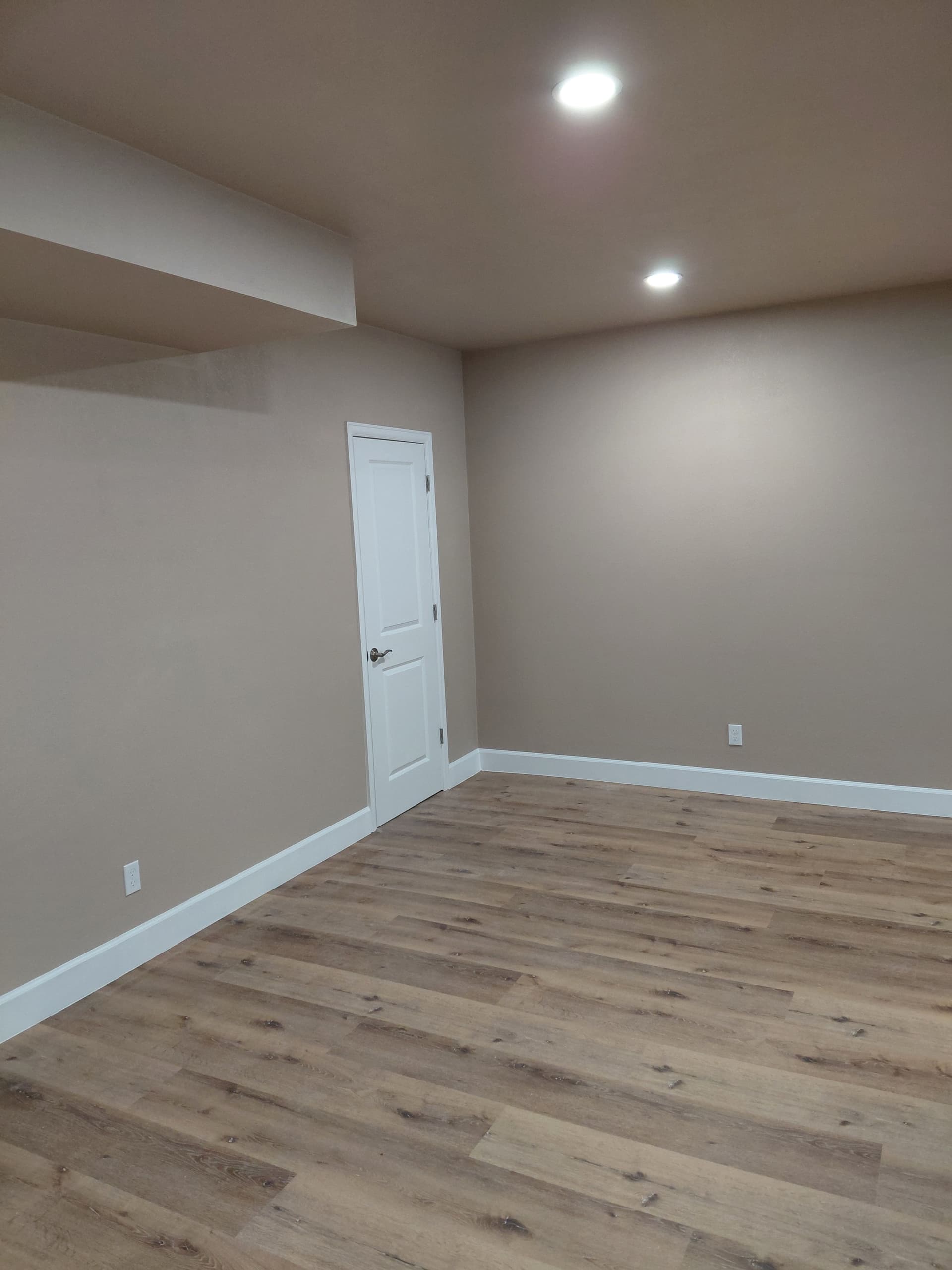 Beautiful Basement Makeover with New Flooring and Stylish Trim