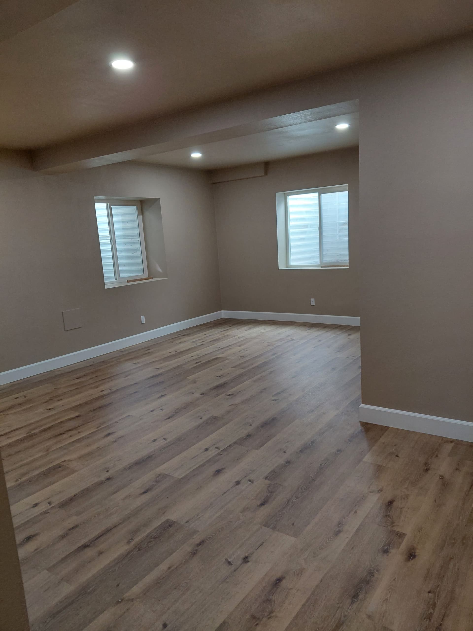 Beautiful Basement Makeover with New Flooring and Stylish Trim