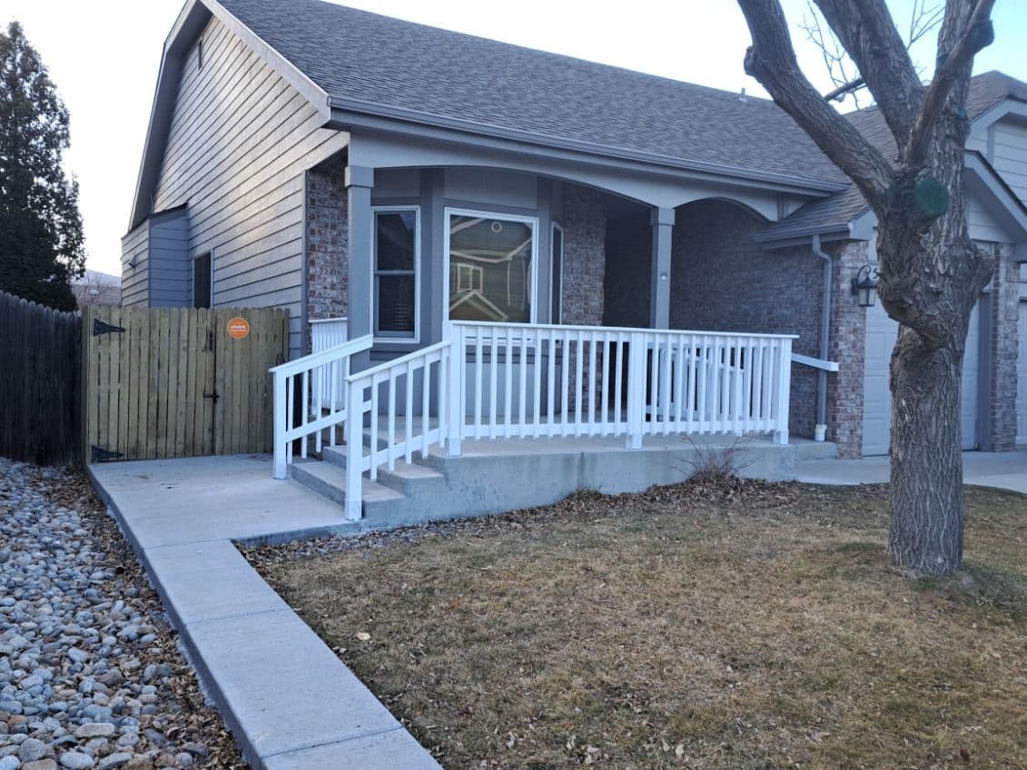 Porch Makeover with Stylish White Railing