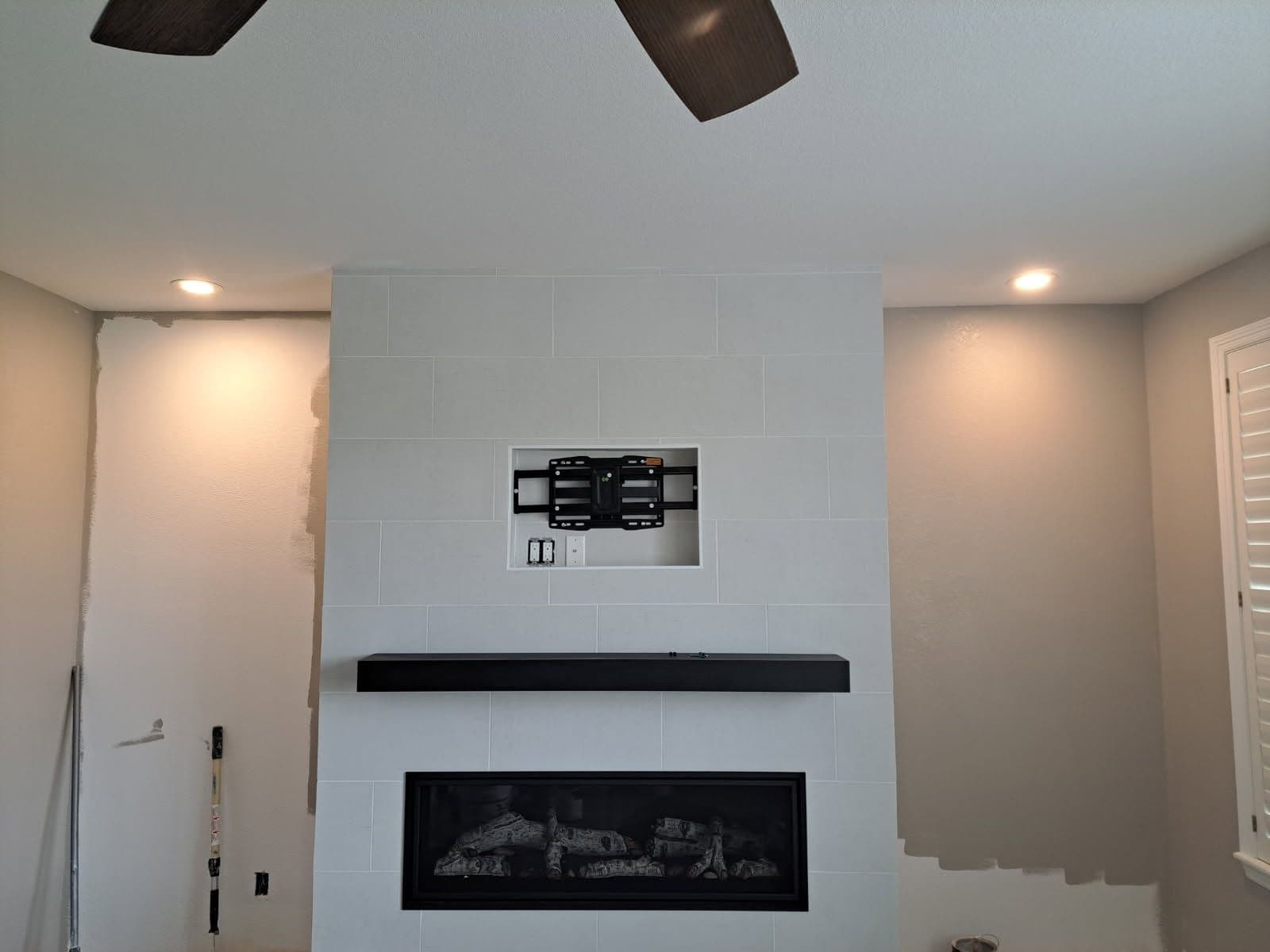Gallery photos for Tiled Elegance Meets Modern Comfort in Fireplace Update: Image #1